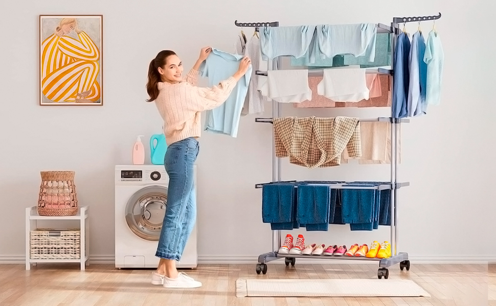 women using clothes drying rack