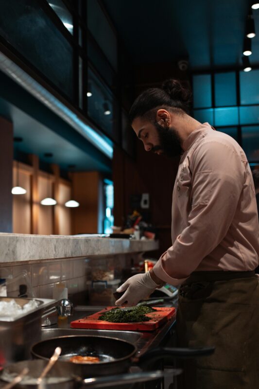 Man chopping vegetable