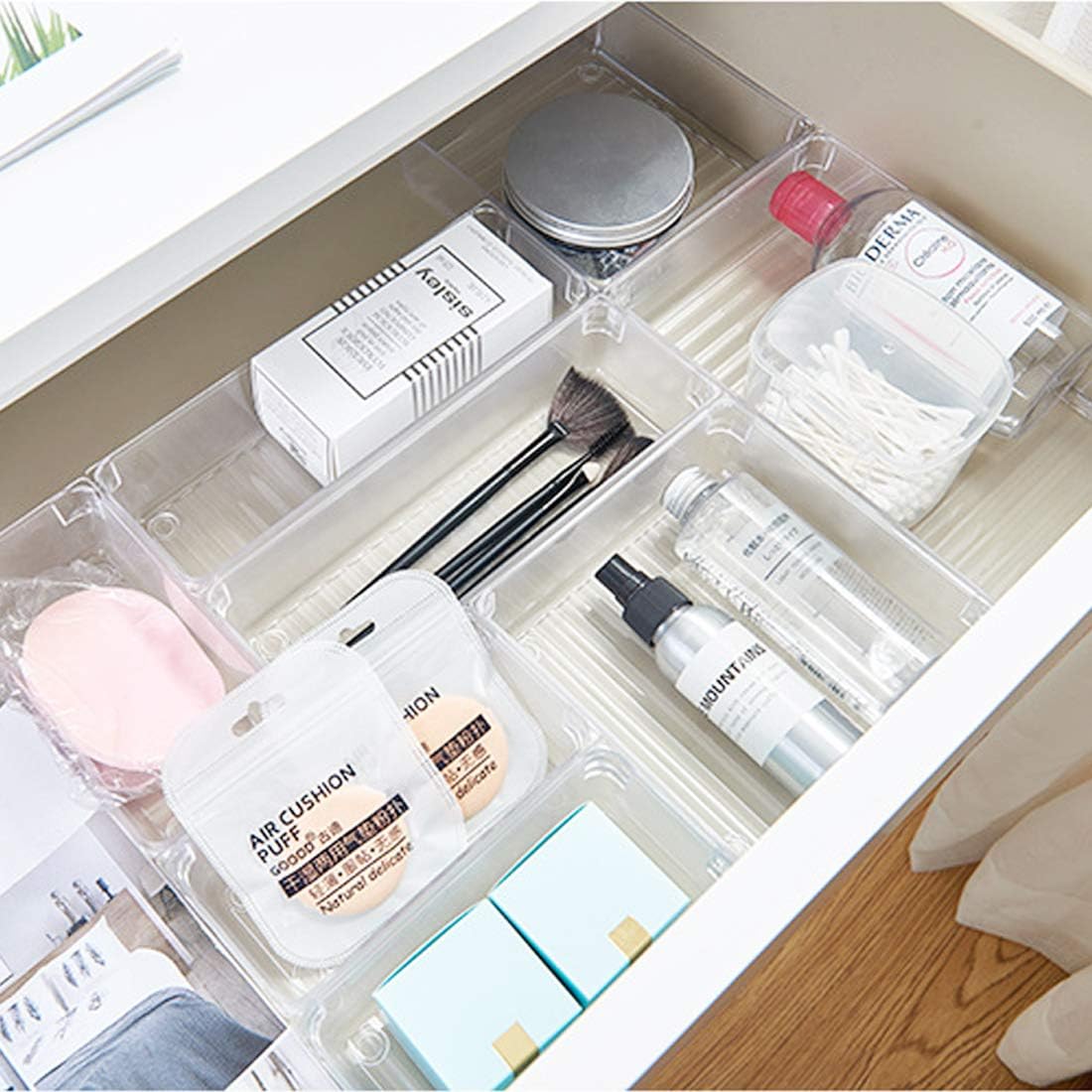 An organized drawer containing makeup essentials and beauty products.