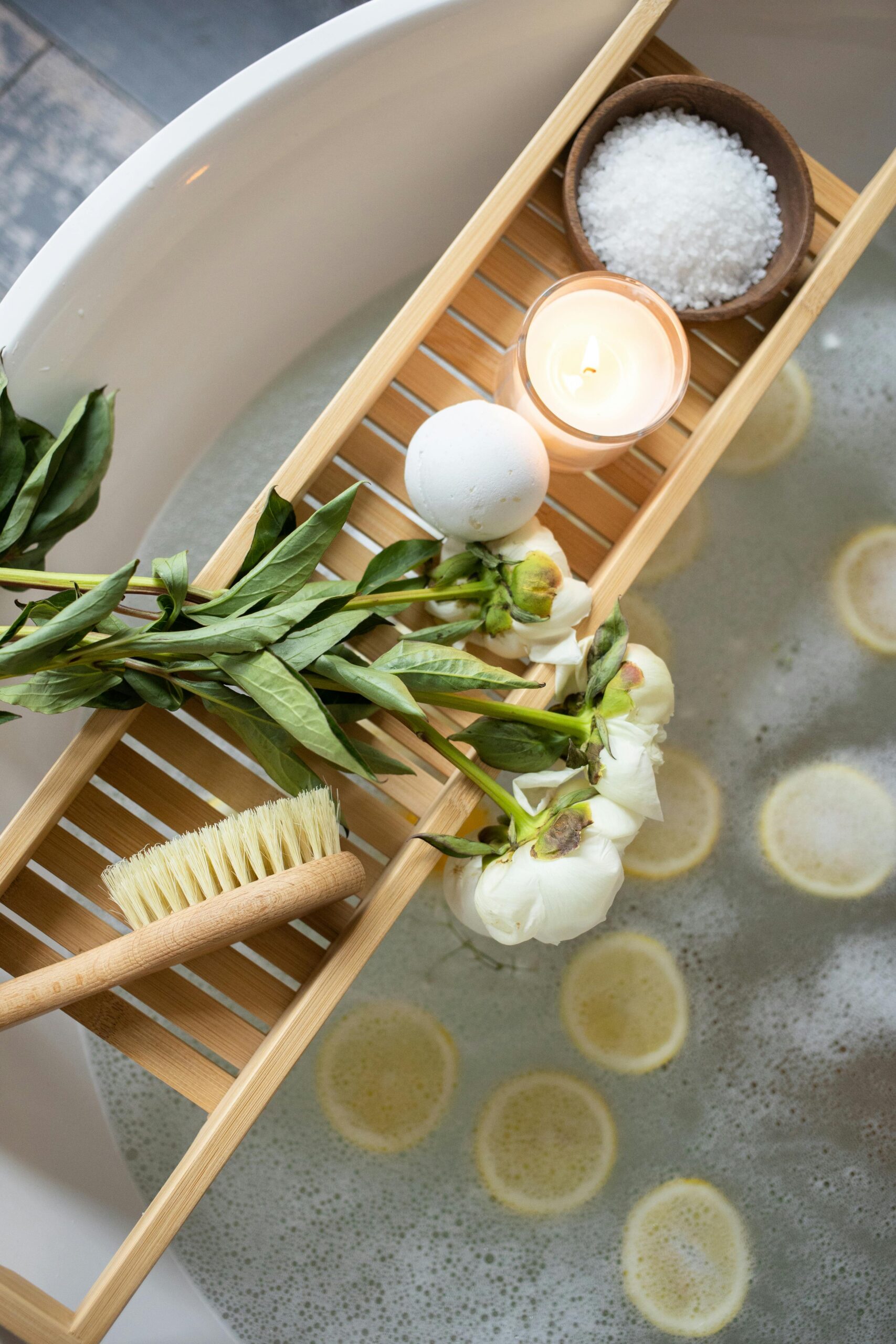 A bathtub full of water and blooming flowers, providing a peaceful and rejuvenating experience