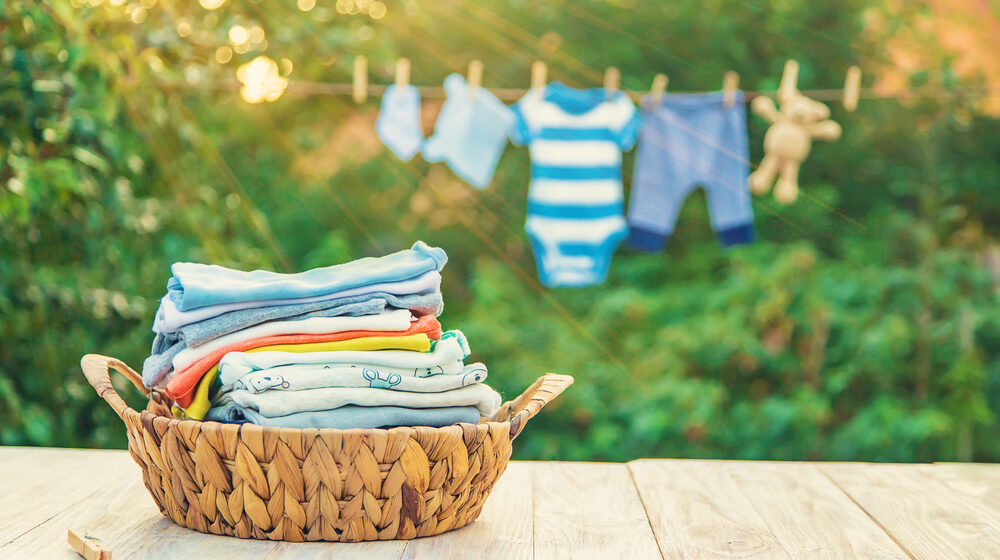 Laundry drying on a clothesline in a basket.