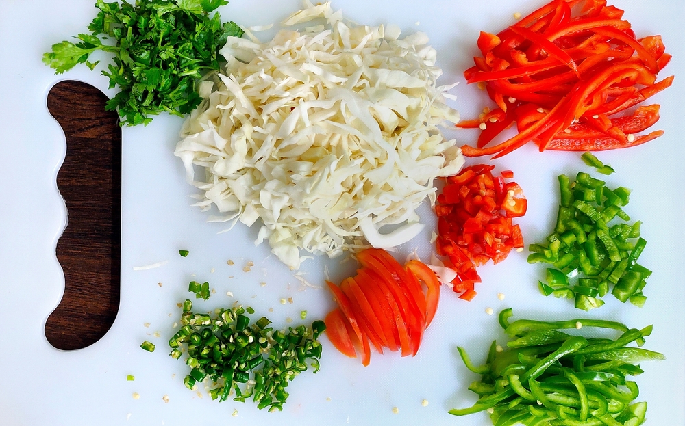 A top view of Chopped vegetables on white chopper