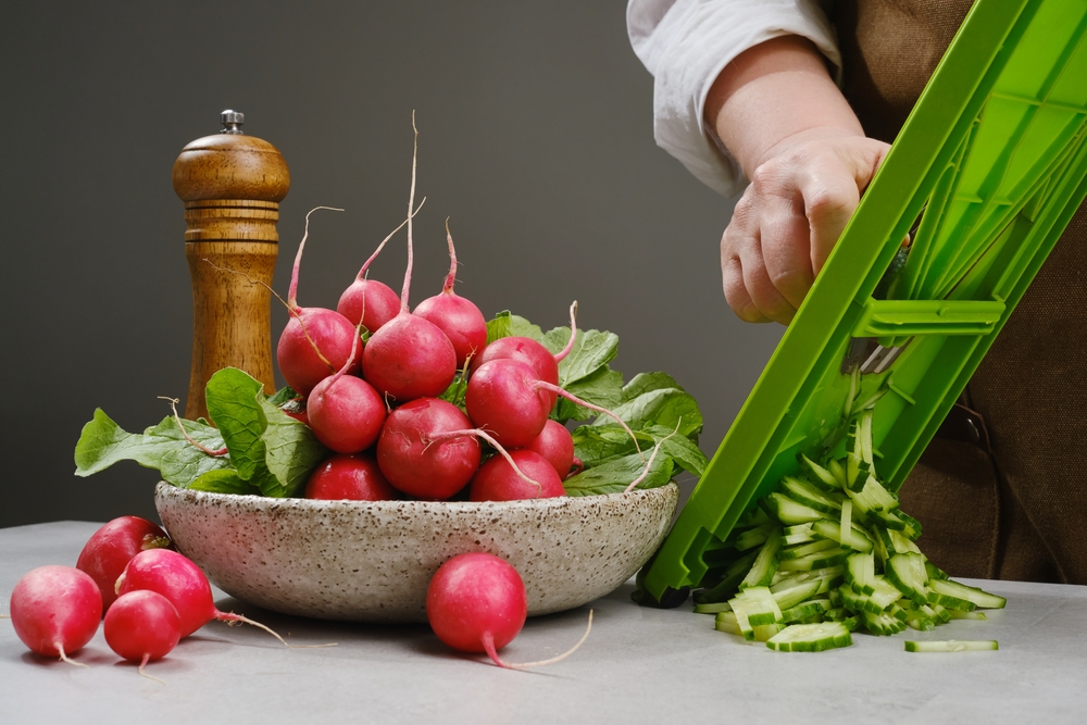 Chef chopping vegetables using vegetable chopper