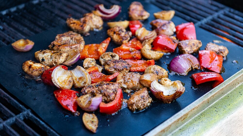 grilled meats and vegetables on the bbq